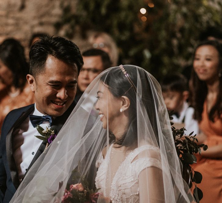 Happy bride and groom during the rustic barn wedding ceremony