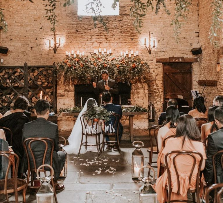 Cripps barn intimate wedding ceremony with foliage wedding decor