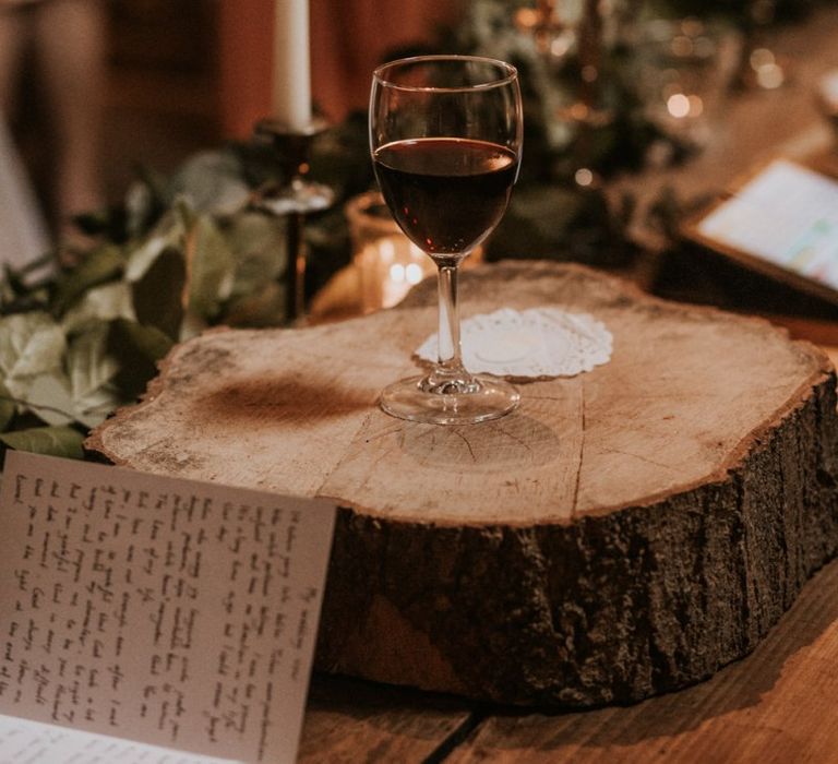 Mulled wine on tree stump at Autumn wedding