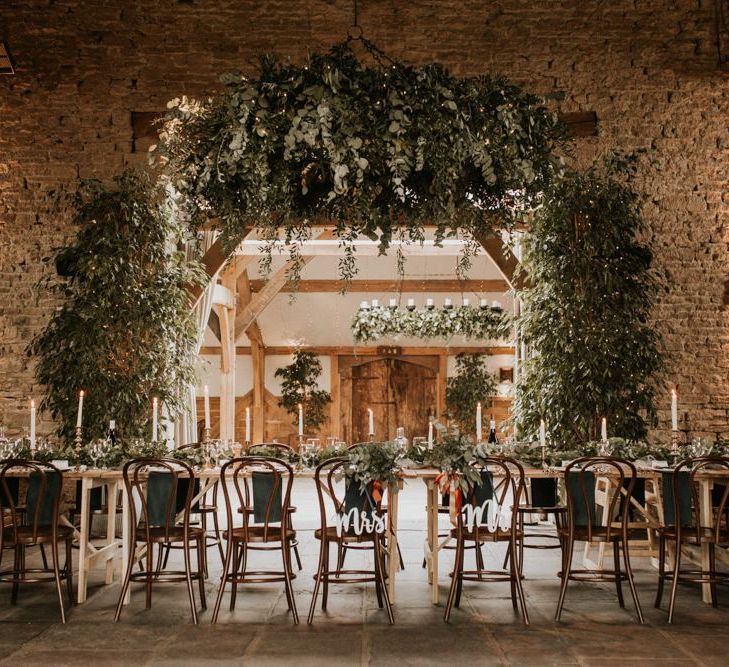 Intimate wedding reception at Cripps Barn with foliage wedding decor