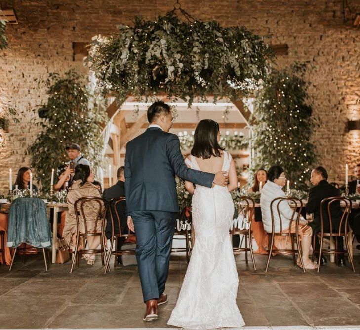 Bride and groom standing in their intimate wedding reception