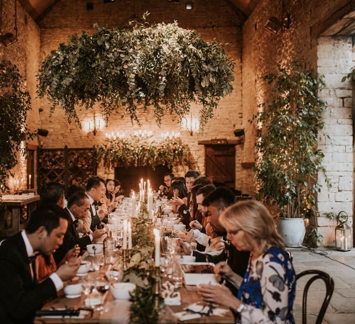 Intimate wedding breakfast at Cripps Barn with candle light centrepieces