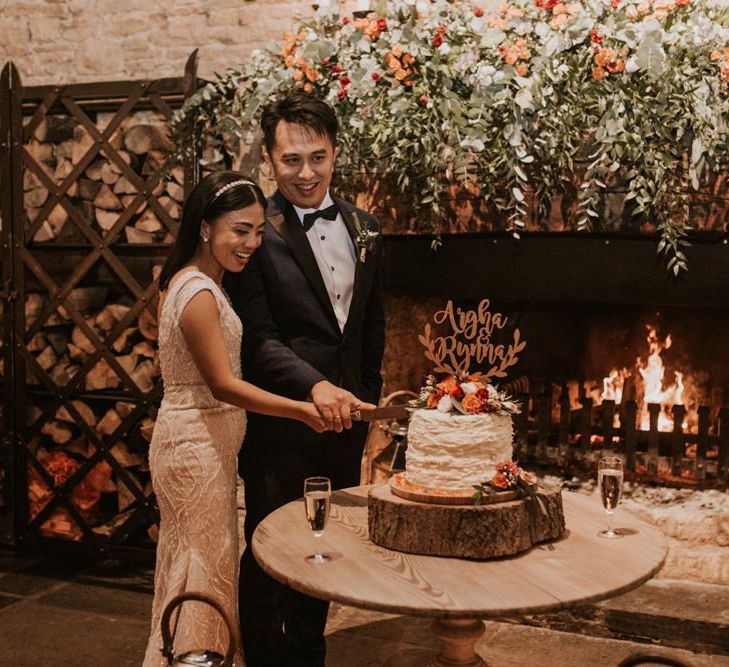 Bride and groom cutting the wedding cake at micro wedding