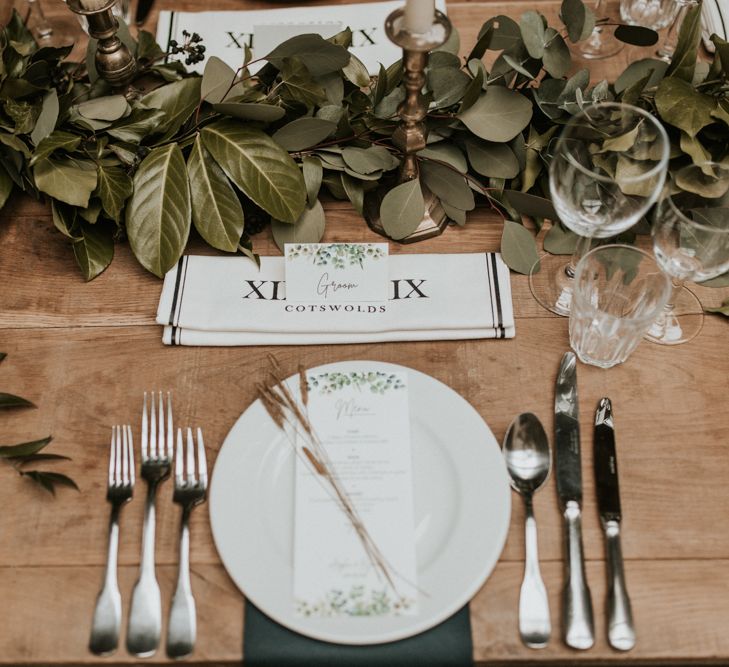 Place setting with foliage table runner and menu card