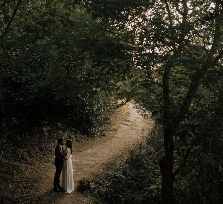 Bride in Donatelle Godart Wedding Dress &amp; Groom in De Fursac Suit