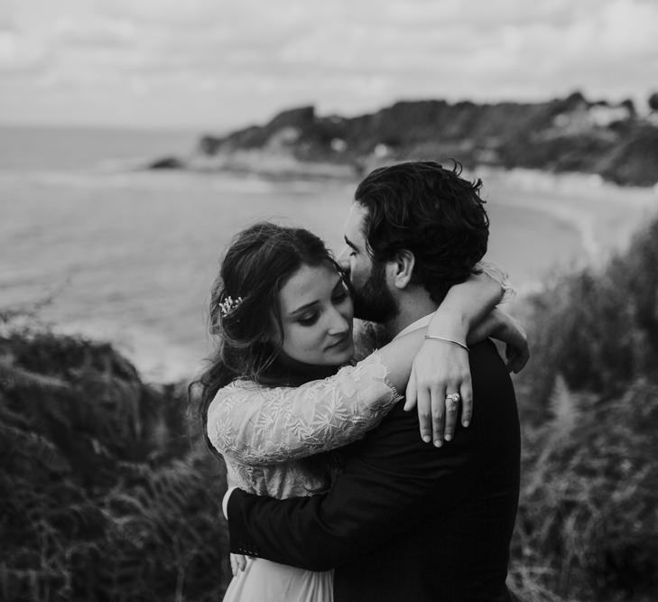 Coastal Portrait of Bride in Donatelle Godart Wedding Dress &amp; Groom in De Fursac Suit