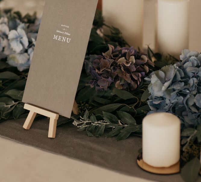 Greenery Table Runner with Candles and Menu Card on Miniature Easel