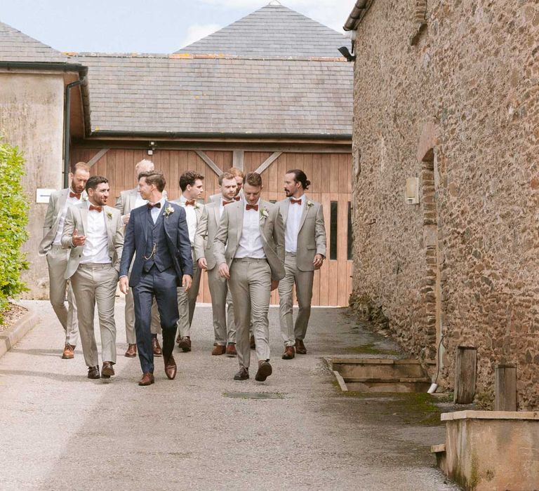 Groom with groomsmen wearing matching suits and bowties at Shilstone House wedding