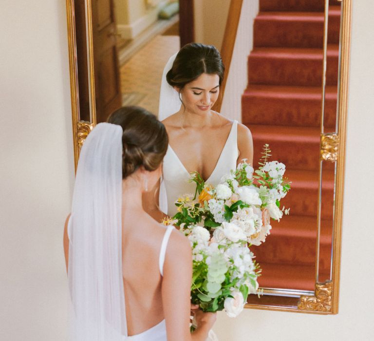 Cathedral veil with lace detail  and open back wedding dress