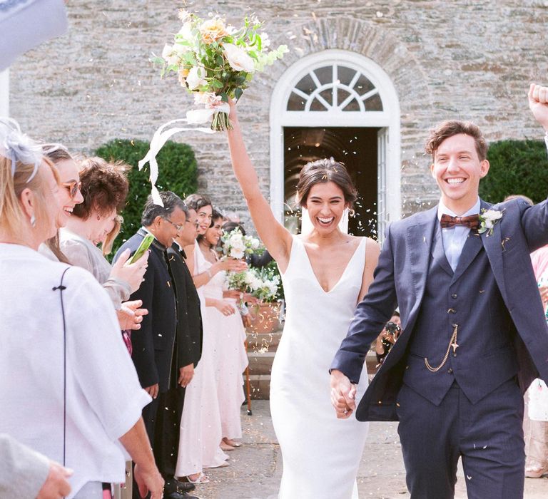 Bride and Groom confetti exit from ceremony