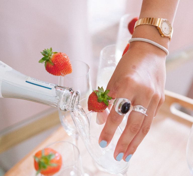 Pouring champagne during preparations at Shilstone House wedding