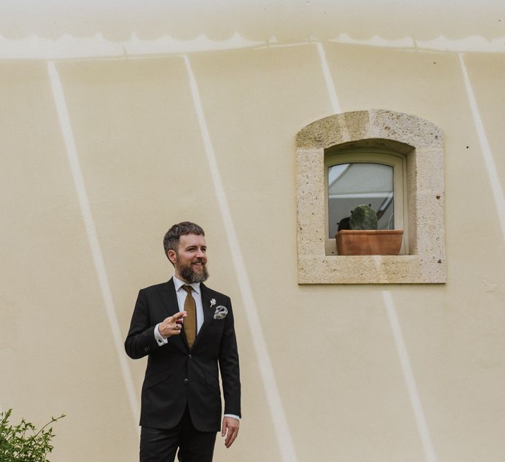 Groom prepares for wedding ceremony