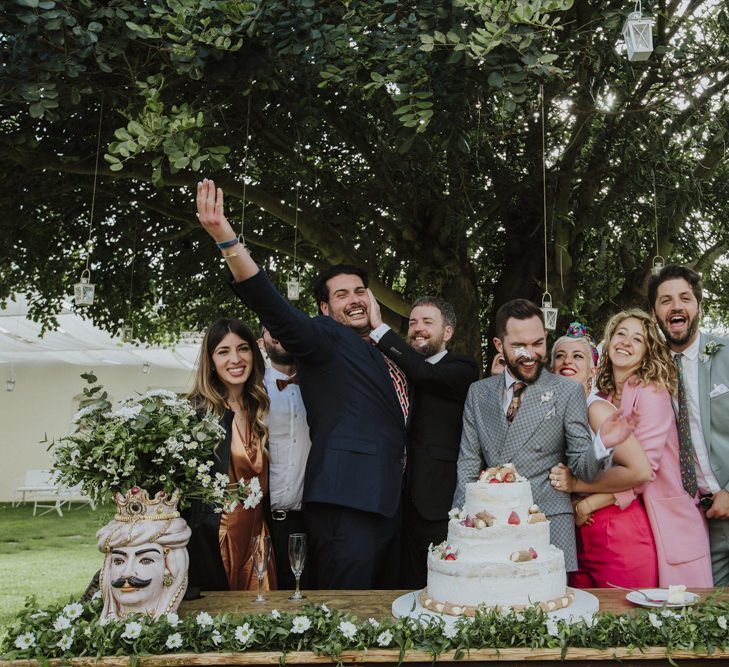 Grey groom suit for grooms celebrating with guests