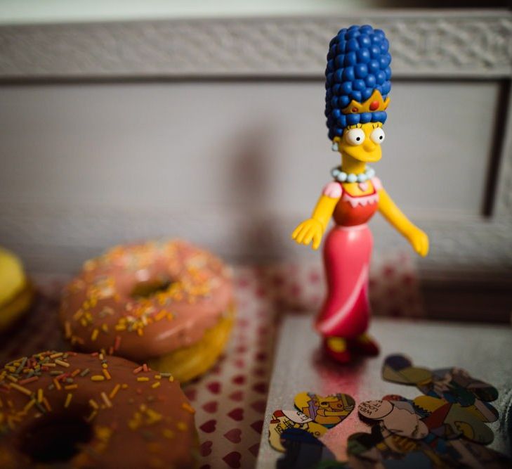 The Simpsons themed doughnuts at casual wedding in London with bright floral decor