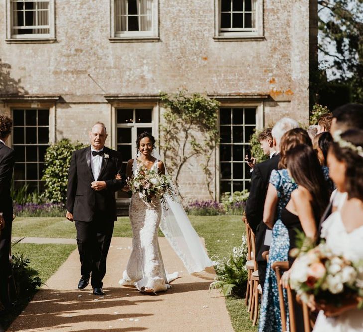 Outdoor ceremony bridal entrance at Babington House wedding venue