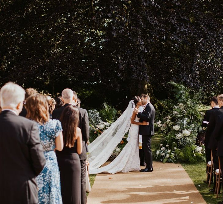 You may now kiss the bride at outdoor wedding ceremony