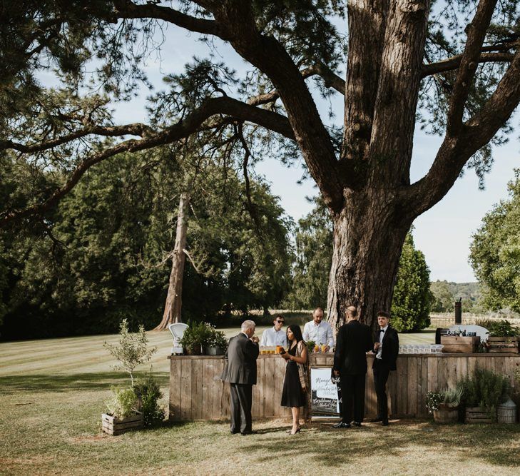 Outdoor rustic bar at Babington House wedding venue