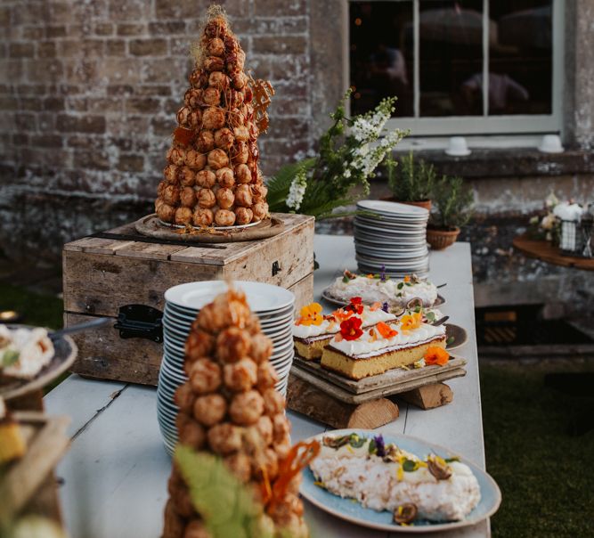 Dessert table with croquembouche tower