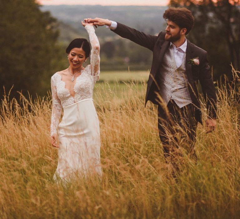 Bride and groom portrait with bride in long sleeve wedding dress