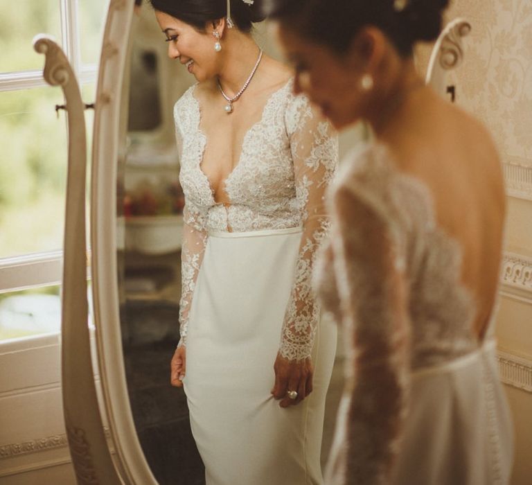 Bride in lace long sleeve wedding dress