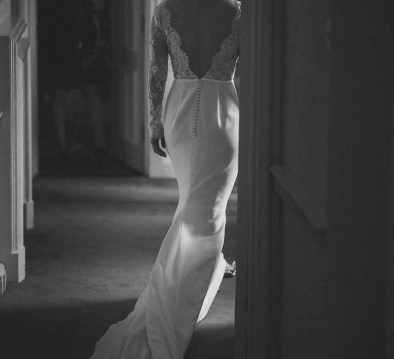 Low V back wedding dress with button detail and long train