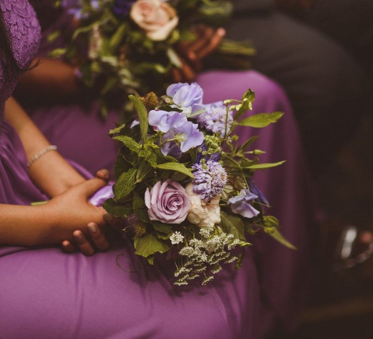 Bridesmaid poset with purple flowers and foliage