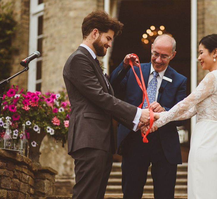 Hand fastening ceremony at Hedsor House wedding