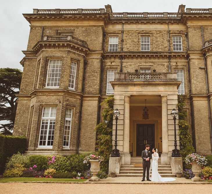 Bride and groom portrait in front of Hedsor House wedding venue