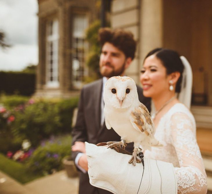 Bride holding a snowy barn owl