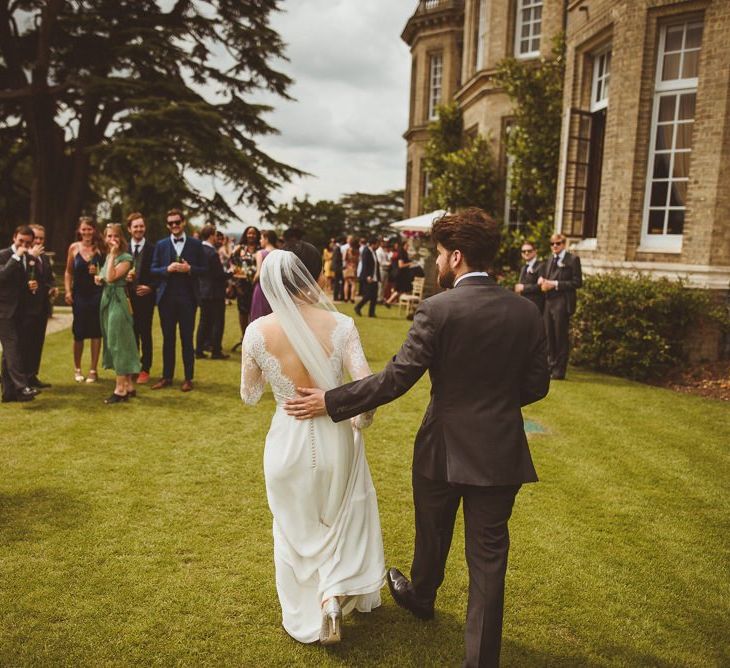 Outdoor drinks reception at country house wedding venue