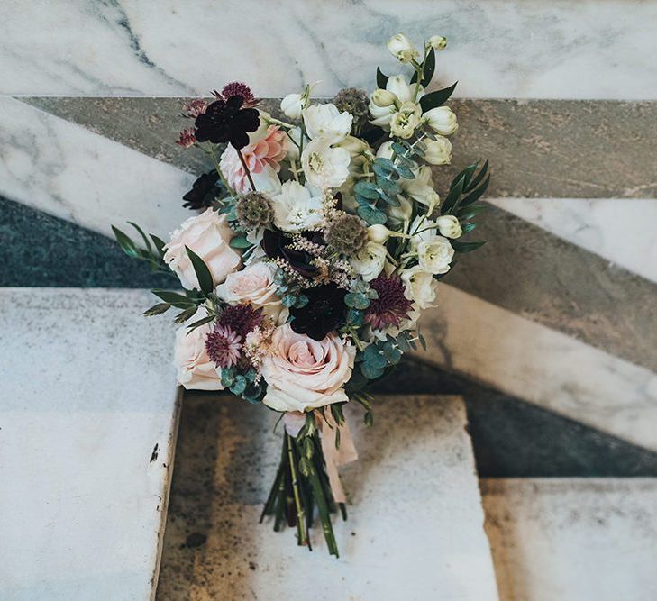 Wedding bouquet with burgundy, apricot and dusky pink autumnal flowers