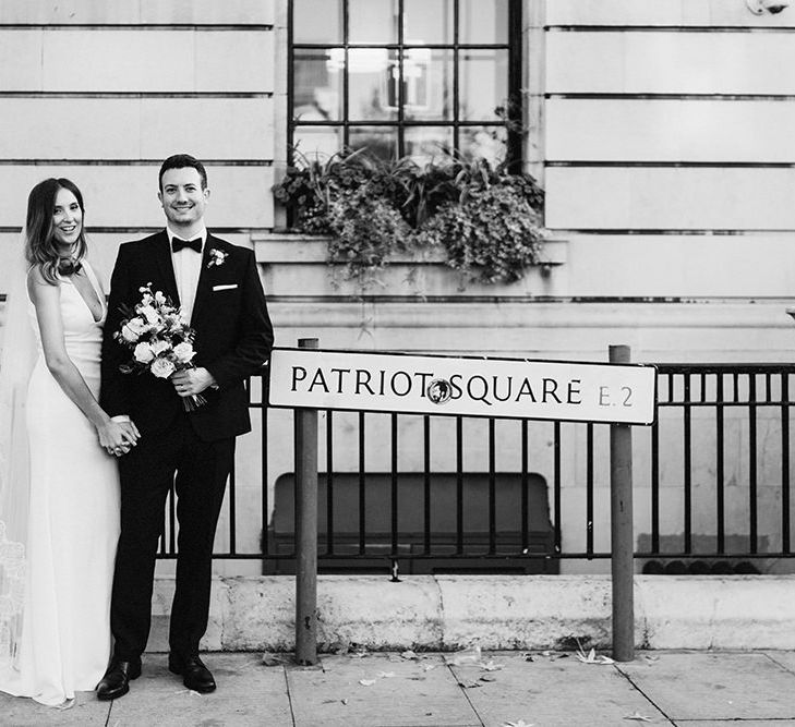 Bride and Groom relaxed wedding with East London road sign