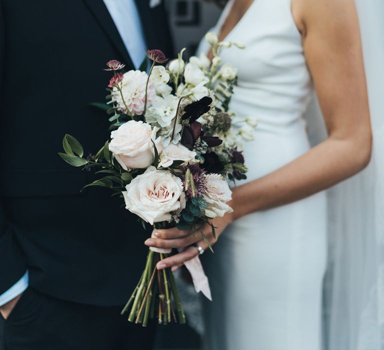 Dusky pink, apricot and burgundy flowers for elegant bouquet