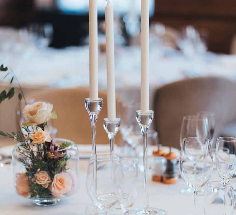 Dusky pink and apricot table centrepieces at city wedding in London