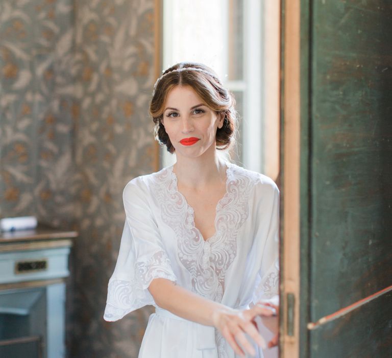 Beautiful Bride with Red Lipstick in White Getting Ready Robe,