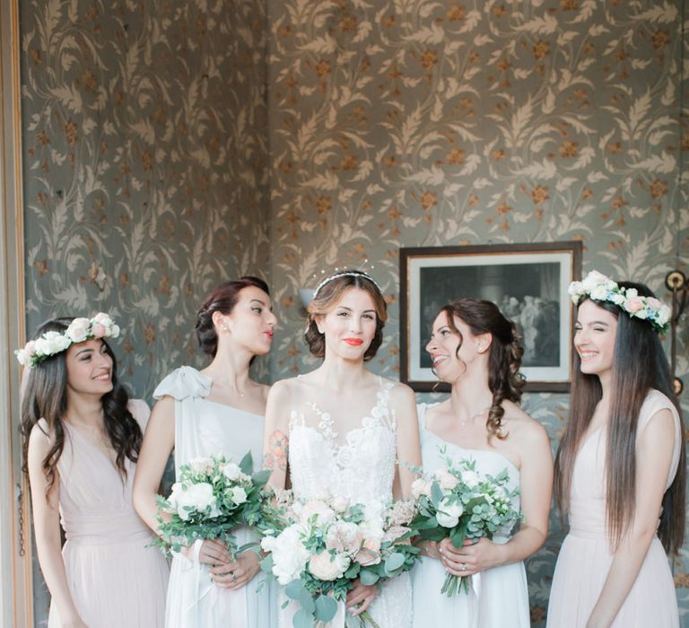 Bridal Party with Bride in Lace Atelier Eme Wedding Dress and Bridesmaids in Peach and White Dresses