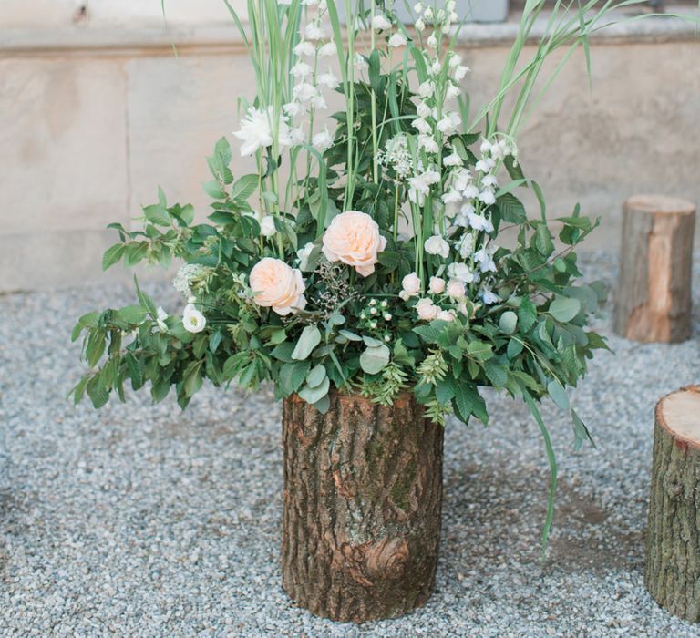 Tree Stump Floral Arrangement with Foliage and Pink Flowers