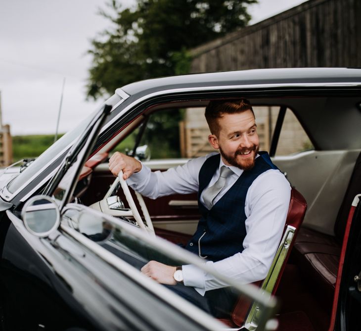 Groom in Black Ford Mustang Wedding Car