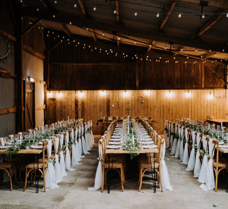 Rustic Barn Wedding Reception with Drape Chair Back Decor, Foliage and Candle Light Centrepieces