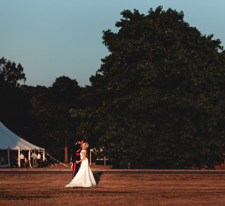 Sandhurst Military Academy Marquee Wedding With Bride In Pronovias Bridesmaids In Pink Dresses By Jarlo London Images From Peter Hughes Photography