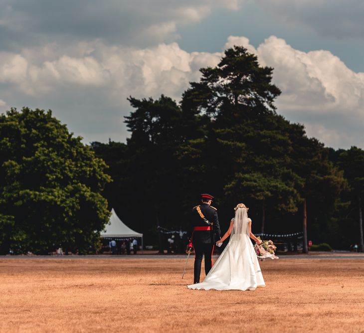 Sandhurst Military Academy Marquee Wedding With Bride In Pronovias Bridesmaids In Pink Dresses By Jarlo London Images From Peter Hughes Photography