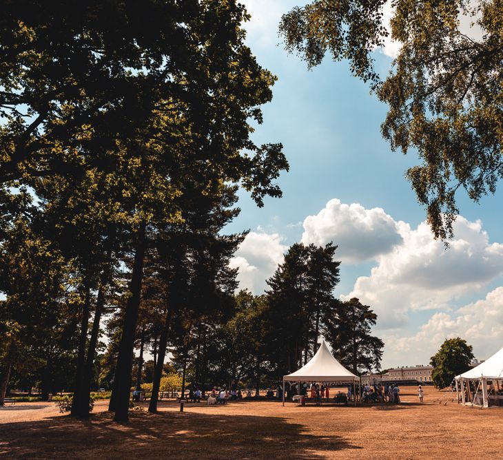 Sandhurst Military Academy Marquee Wedding With Bride In Pronovias Bridesmaids In Pink Dresses By Jarlo London Images From Peter Hughes Photography