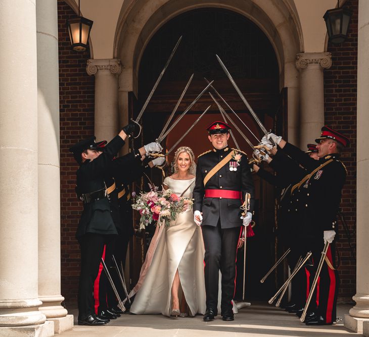 Sandhurst Military Academy Marquee Wedding With Bride In Pronovias Bridesmaids In Pink Dresses By Jarlo London Images From Peter Hughes Photography