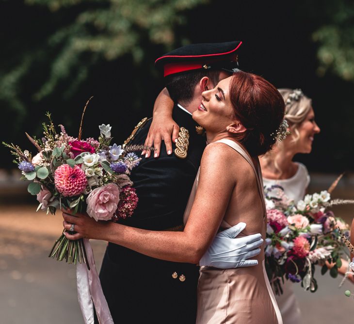 Sandhurst Military Academy Marquee Wedding With Bride In Pronovias Bridesmaids In Pink Dresses By Jarlo London Images From Peter Hughes Photography