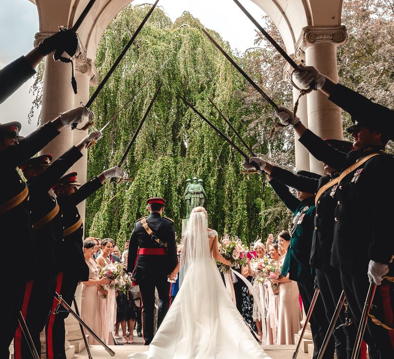 Sandhurst Military Academy Marquee Wedding With Bride In Pronovias Bridesmaids In Pink Dresses By Jarlo London Images From Peter Hughes Photography