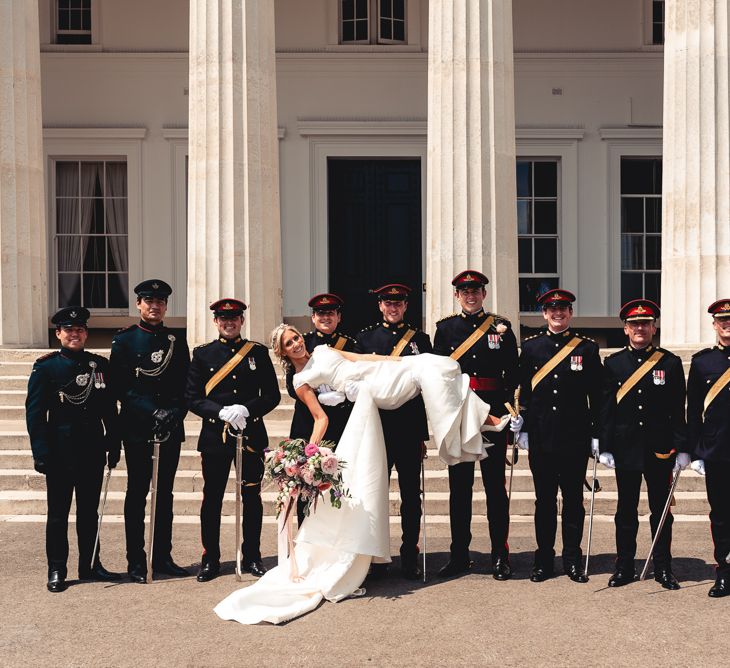 Sandhurst Military Academy Marquee Wedding With Bride In Pronovias Bridesmaids In Pink Dresses By Jarlo London Images From Peter Hughes Photography