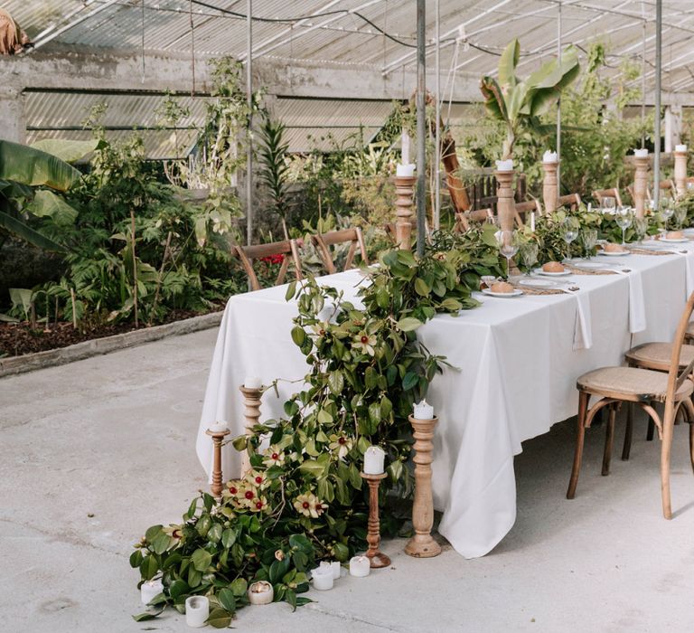 Trailing Galician camellias centrepiece and wooden candlesticks