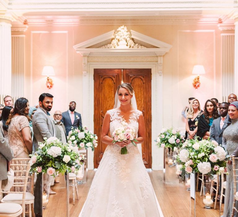 Bride Walking Down the Aisle Alone in a Lace Pronovias Wedding Dress