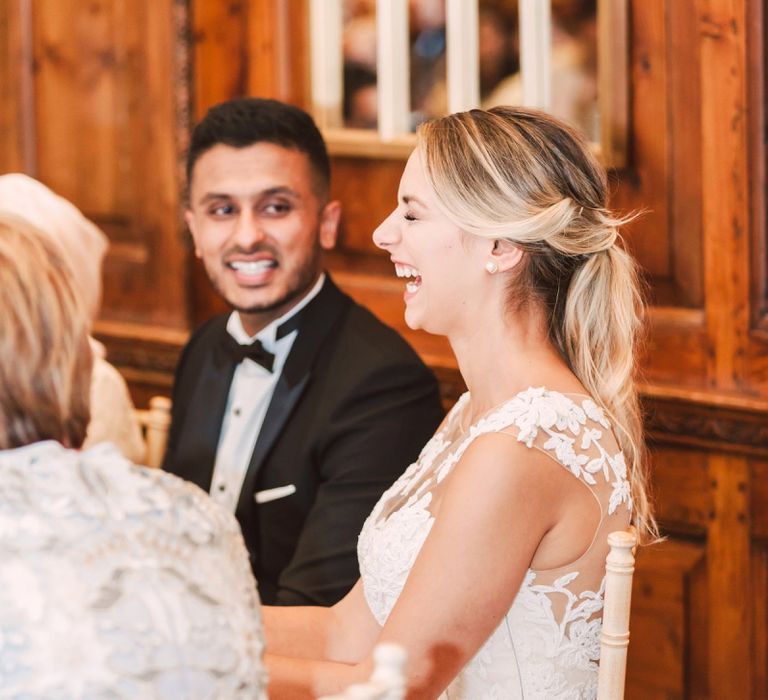 Bride and Groom Laughing During The Wedding Reception Speeches