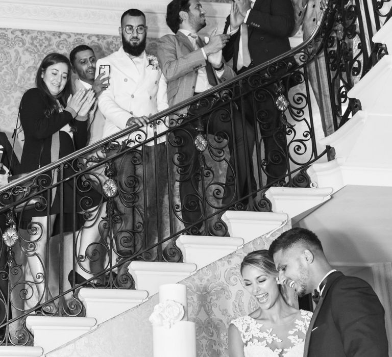 Bride and Groom Cutting The Wedding Cake